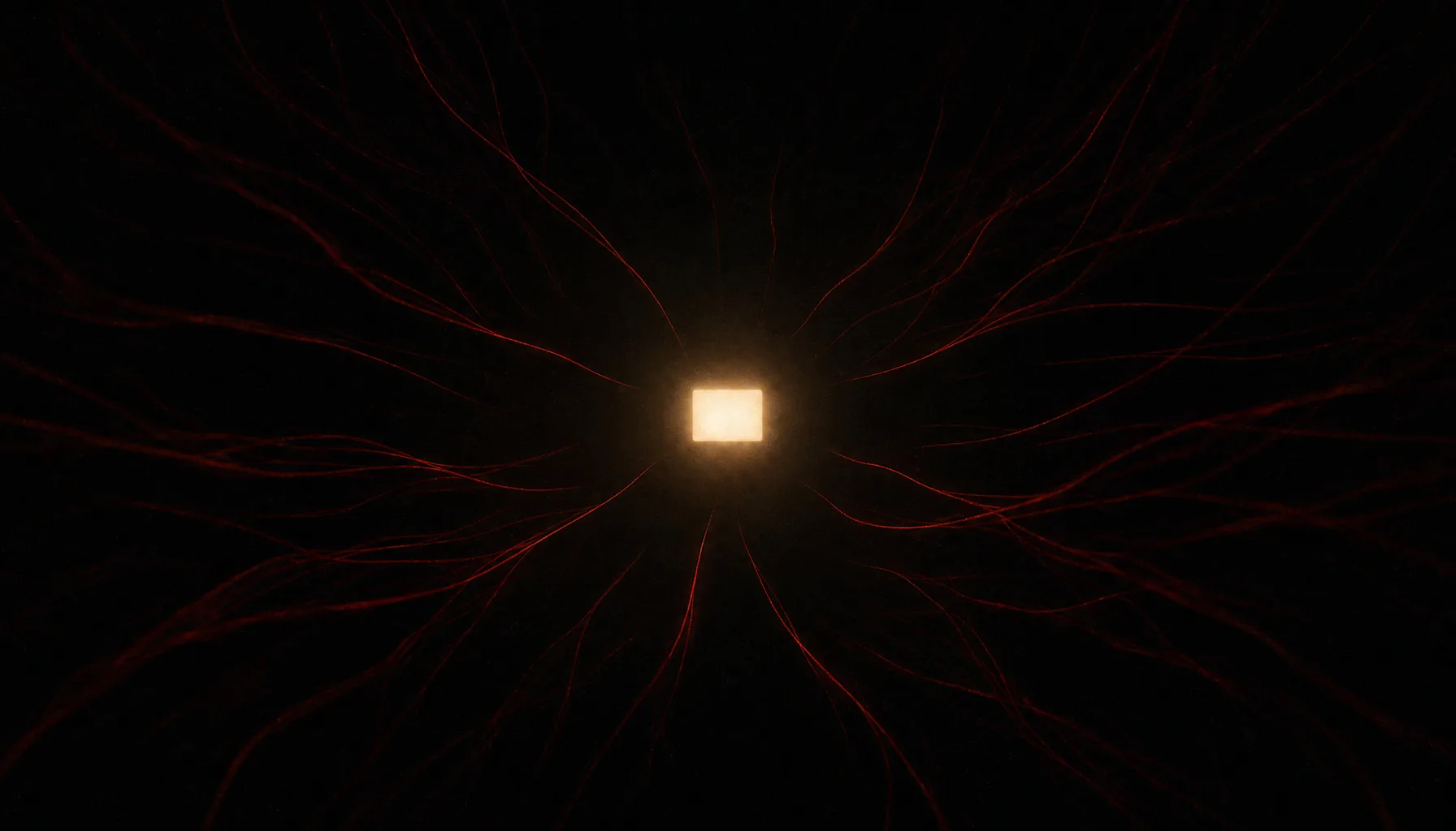 A single lit screen alone in darkness, threads reaching toward it from the surrounding dark